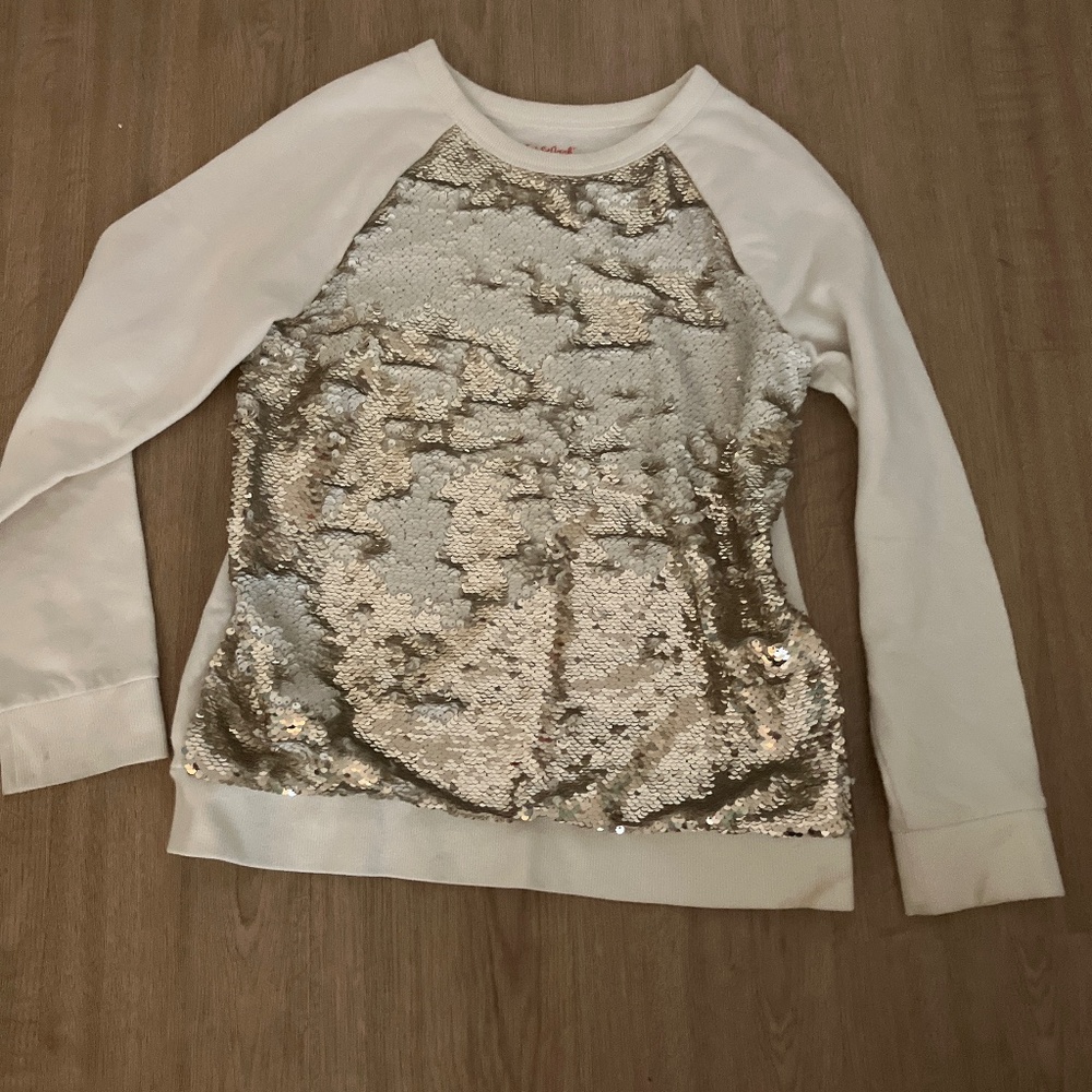 Sequence, gold sweater